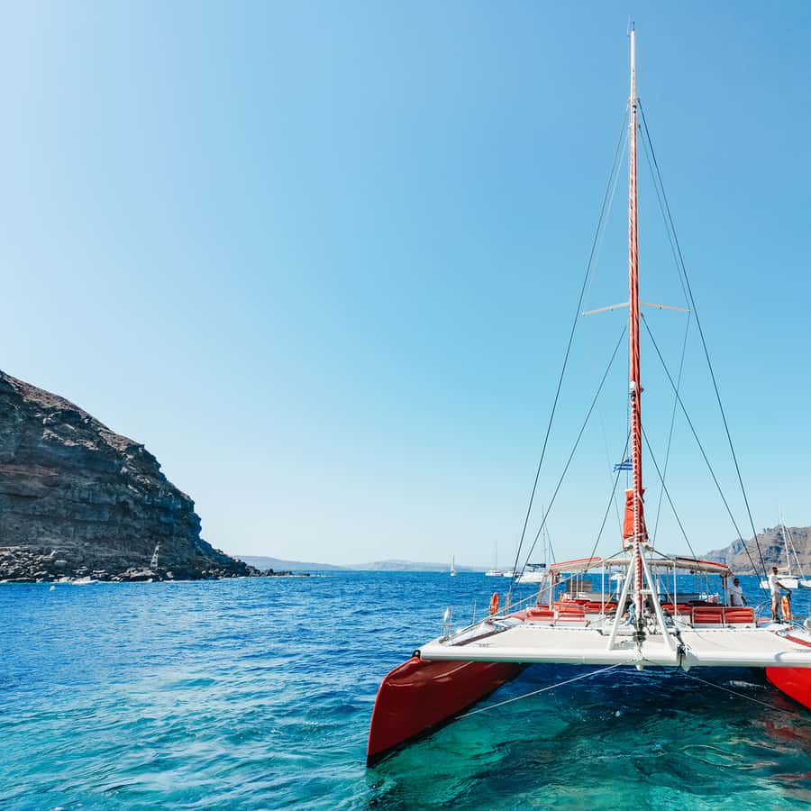 Santorini Catamaran Tour with BBQ Dinner Drinks and Music 